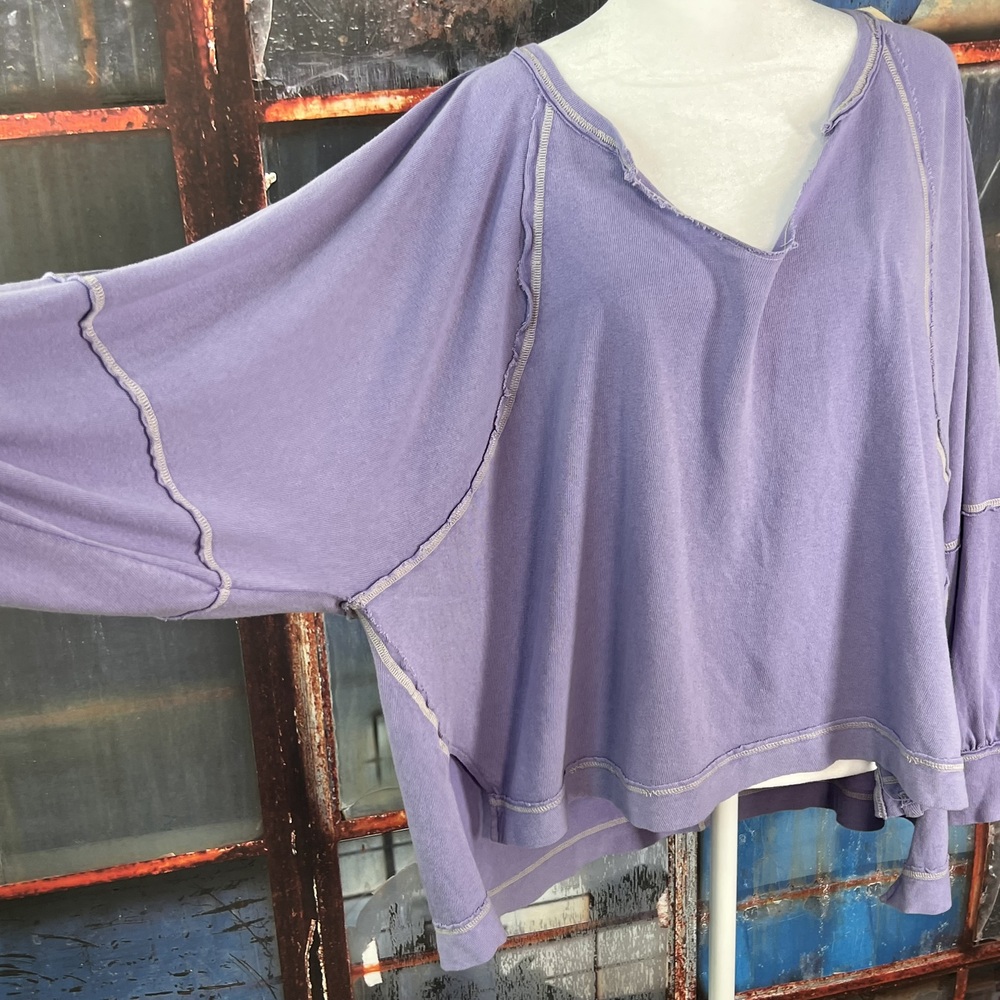 Free People "Wish I Knew" Oversized V-Neck Tee – Relaxed Fit with Exposed Seam
